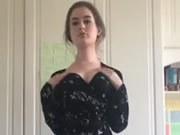 Innocent girl takes off her clothes in the room